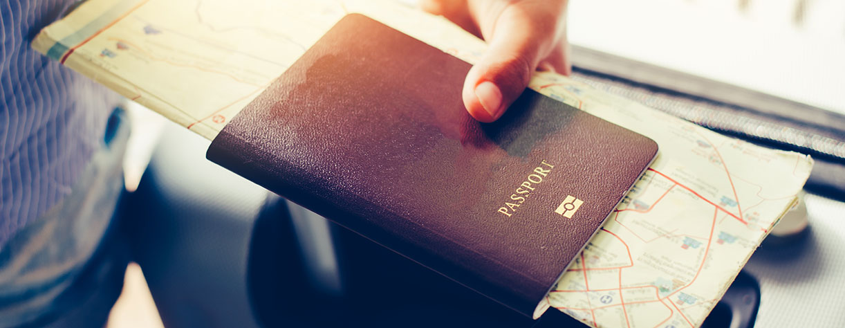 Hand holding passport Hand holding passport