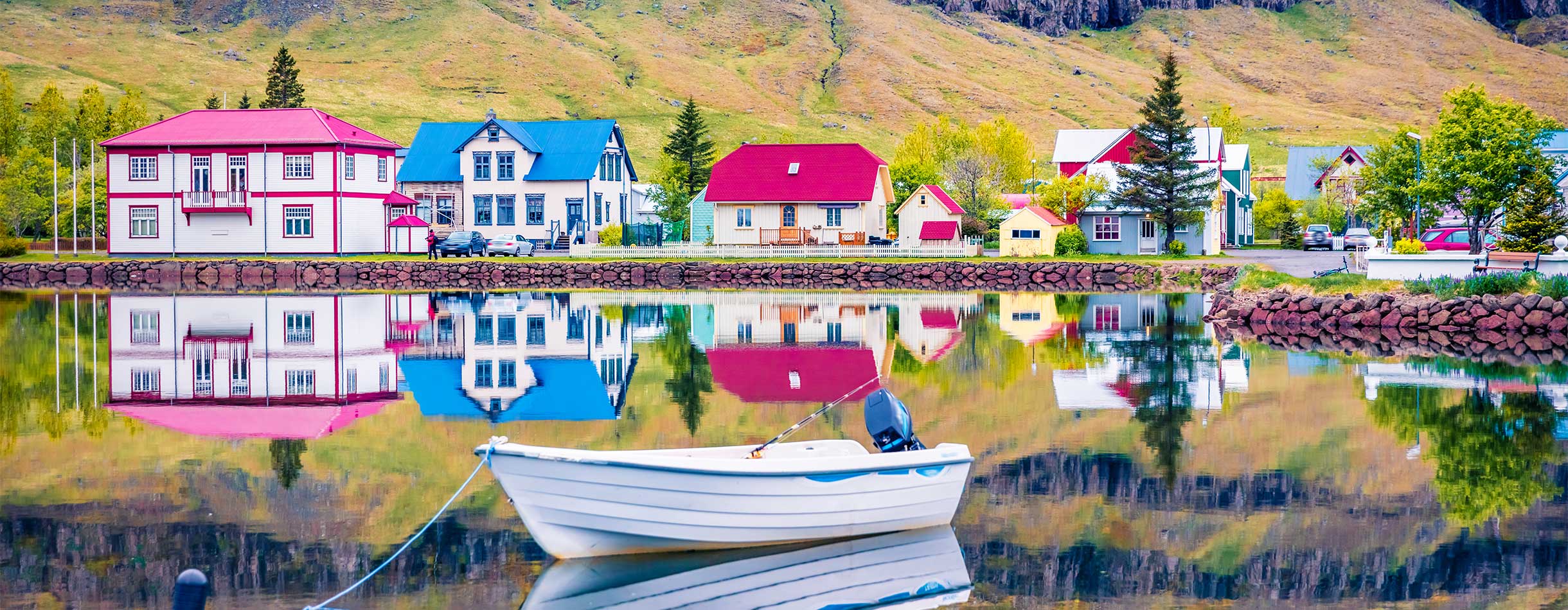 Colorful morning cityscape of small fishing town - Seydisfjordur.