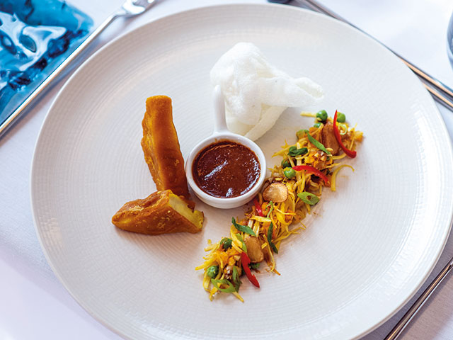 Balinese fried Tofu with vegetables Peanut Sauce and Rice Crackers