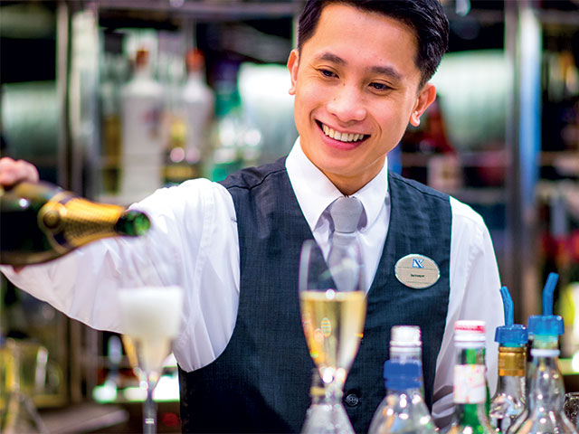 Bar staff pouring champagne, Balmoral