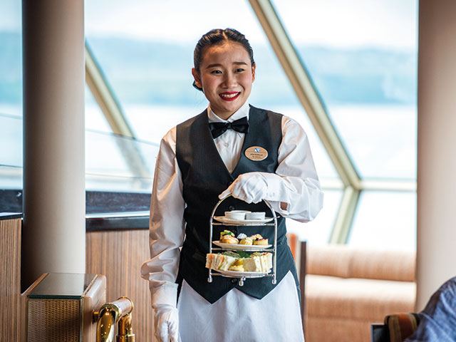 Waitress serving Traditional Afternoon Tea