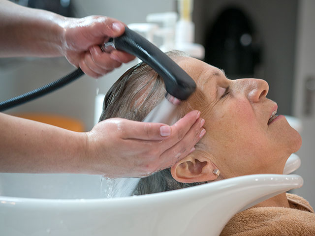 Guest having hair washed in The Atlantis Spa
