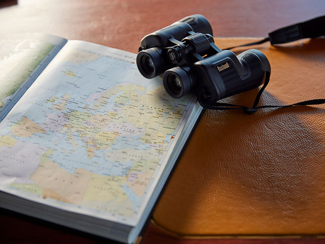 Binoculars and Atlas