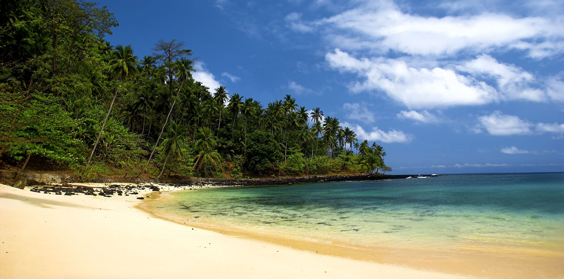 Beautiful beach with a great blue sky and turqoise water in Sao Tome