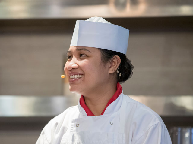 Team member smiling, Kitchen Creations 