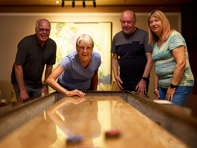 Group enjoying Shuffleboard