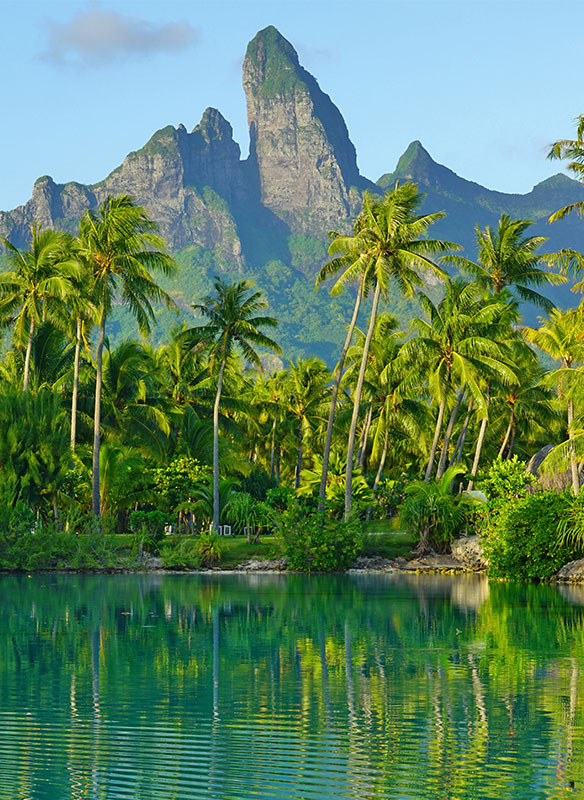 View of the Mont Otemanu mountain reflecting in water at sunset in Bora Bora, French Polynesia,