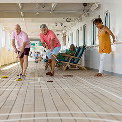 People playing shuffleboard on Borealis