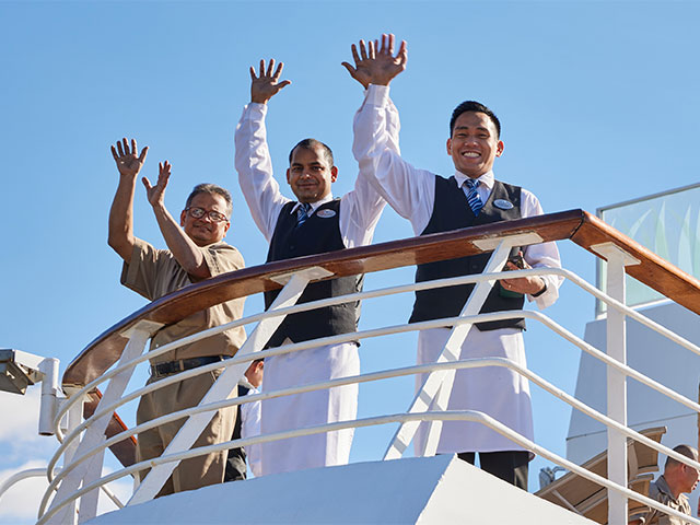 Crew waving at the Fleet in funchal
