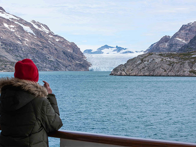 Guest looking out to Prins Christian sund from deck