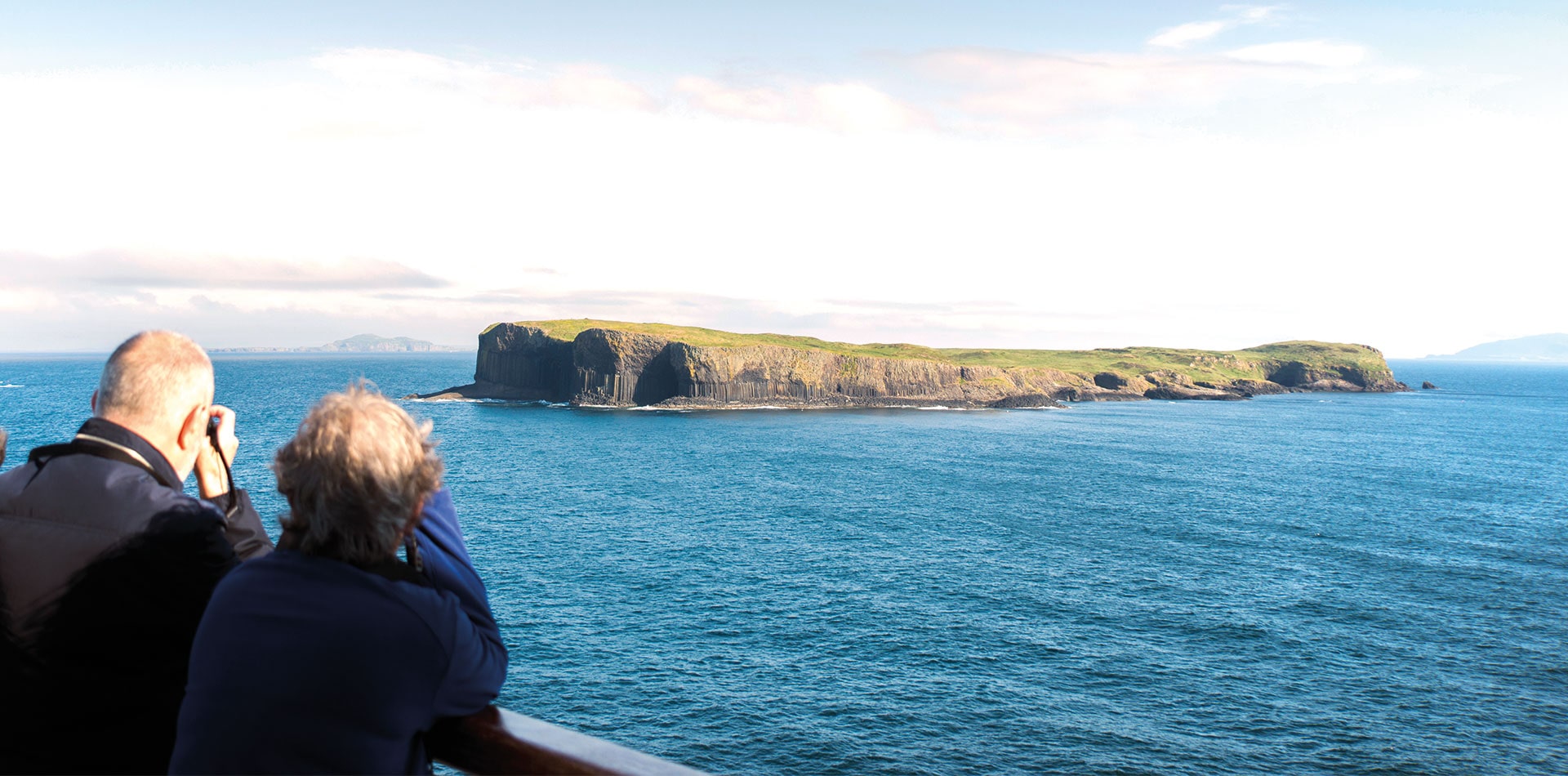 Guests looking out to Fingal's cave, UK from deck