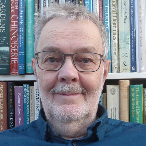 Guest speaker David Winpenny in front of a bookcase
