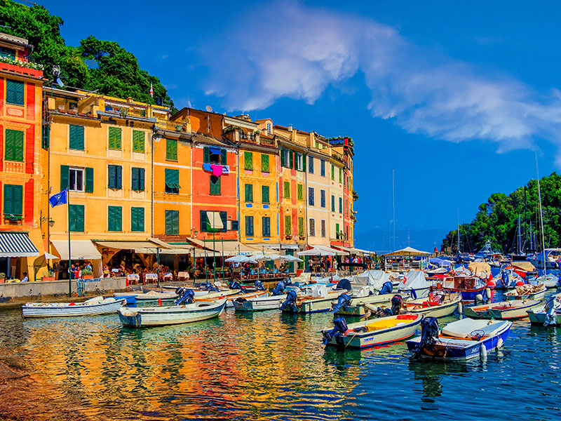 Italian city of Portifino with beautiful blue coastline and colorful buildings