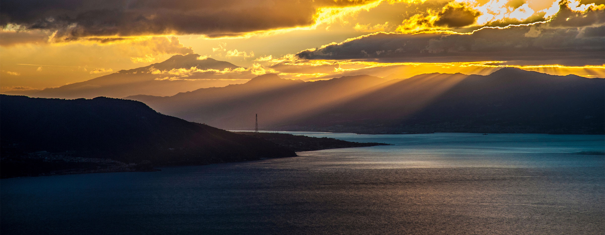 Sunset over the Strait of Messina, Calabria, Italy.