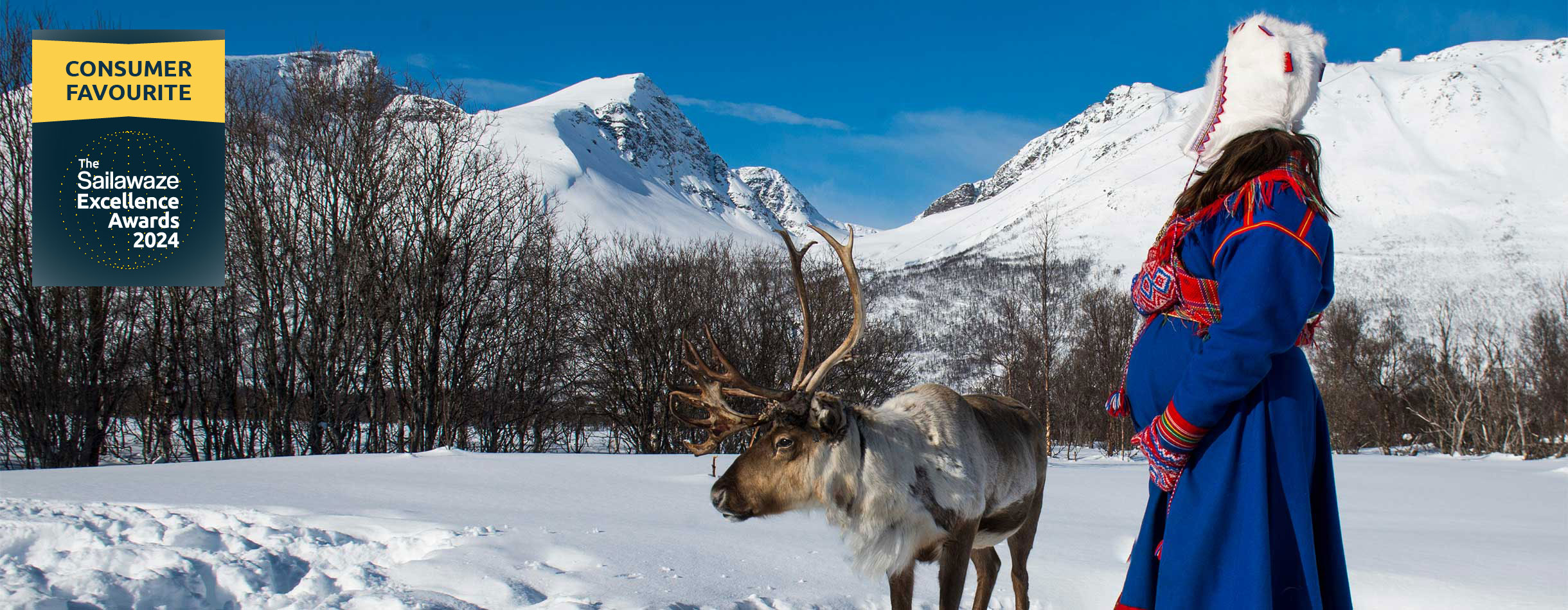 Sami and reindeer in snowy Norway