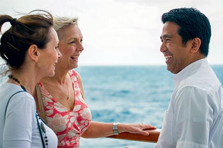 Staff and guest on deck