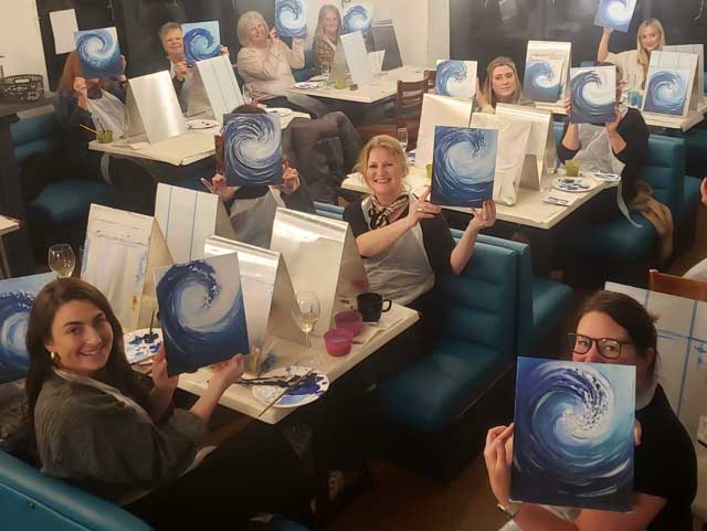 Group showing their artwork