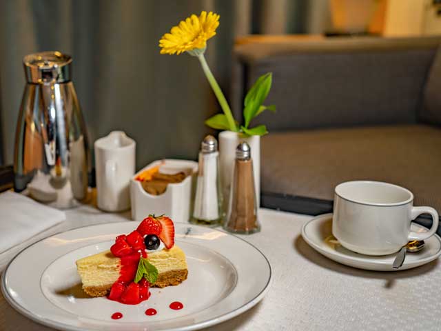 Room service cheesecake and refreshments
