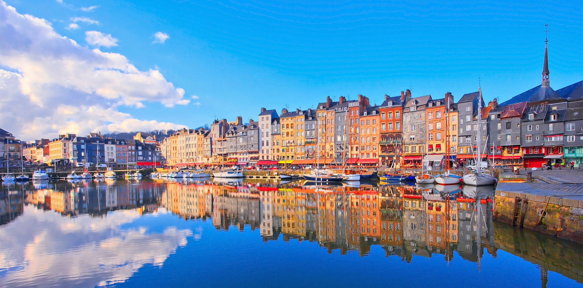 Colourful buildings in Honfleur harbour, France