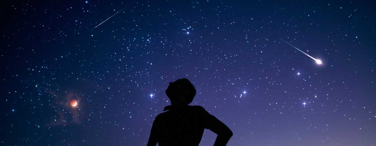 Silhouette of a man star gazing 