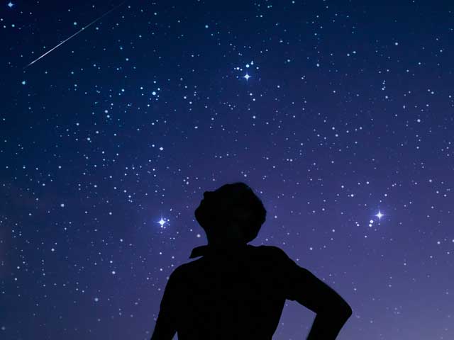 silhouette of a man star gazing 