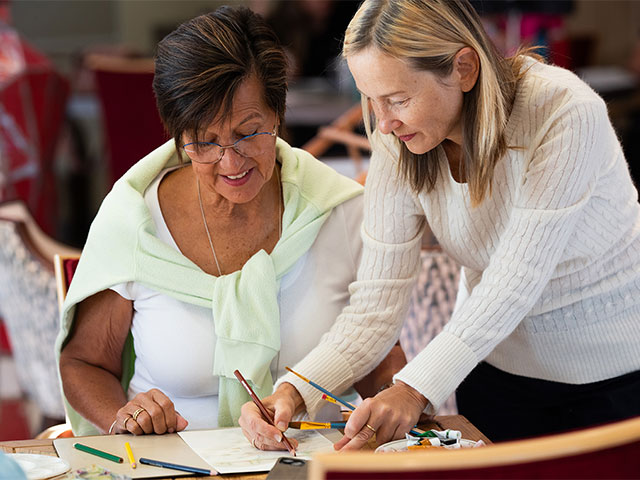 Guest learning to paint on board
