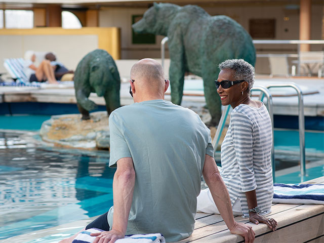 Guests relaxing by the pool, Bolette
