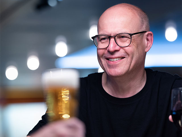 Guests being served a beer in the Morning  pub, Bolette