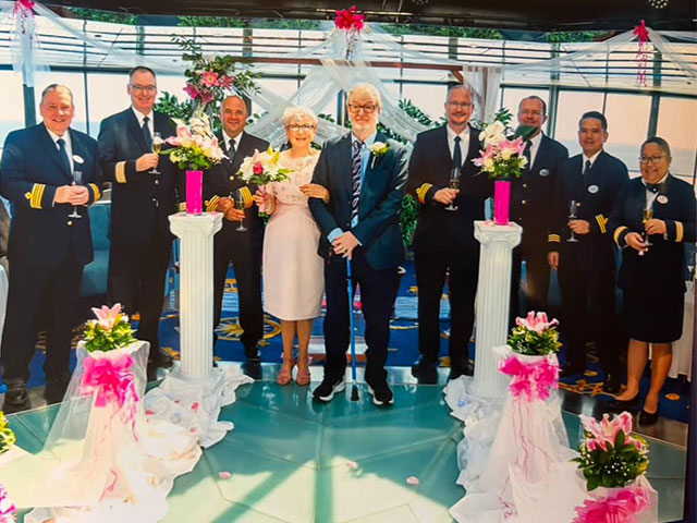Leona Thomas and husband at their ceremony on board , with crew members