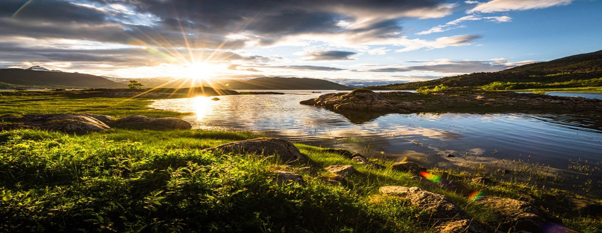 The Midnight Sun over the fjords in Norway