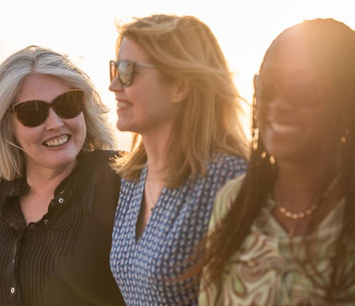friends on deck at sunset