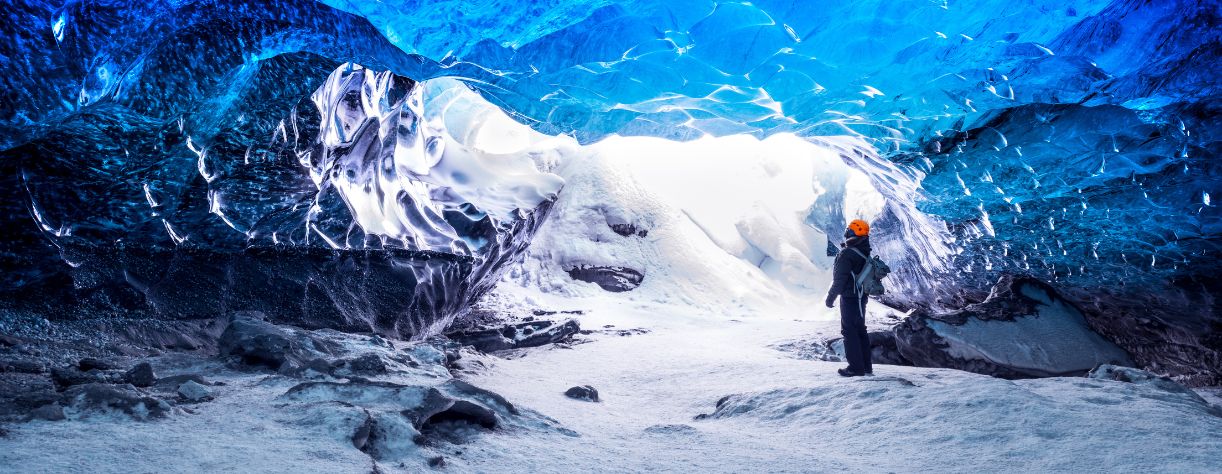 Person inside a glacial ice cave in Iceland