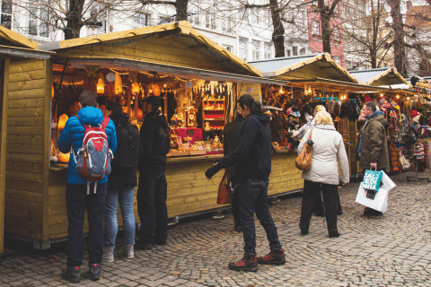 People standing at Christmas market stall 