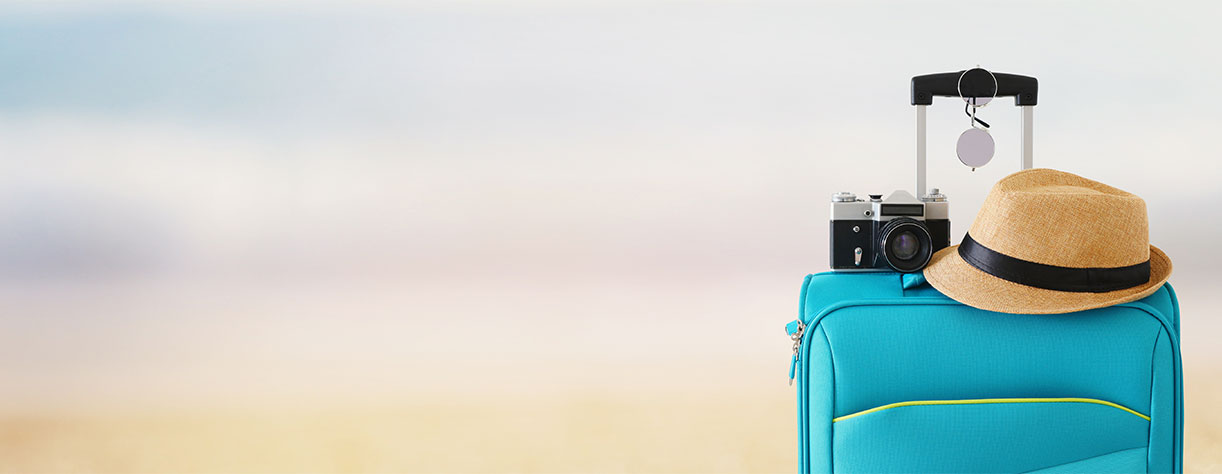 Suitcase with hat and camera