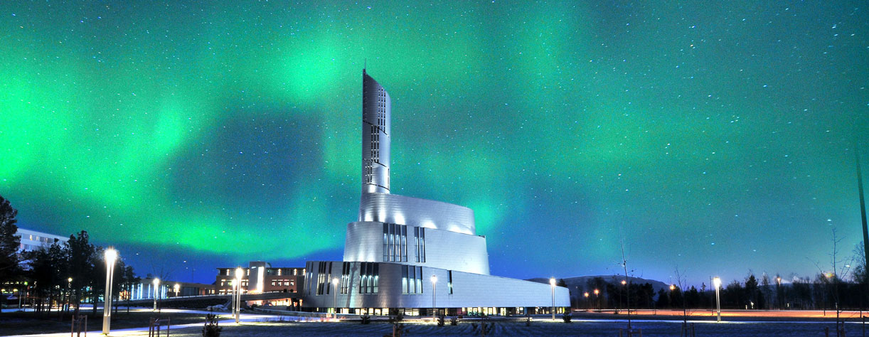 Northern Lights in sky by church in Alta, Norway