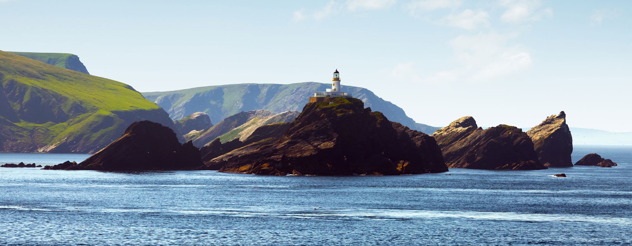 Seascape with lighthouse on the isle Muckle Flugga, United Kingdom, Scotland, Shetland Islands.