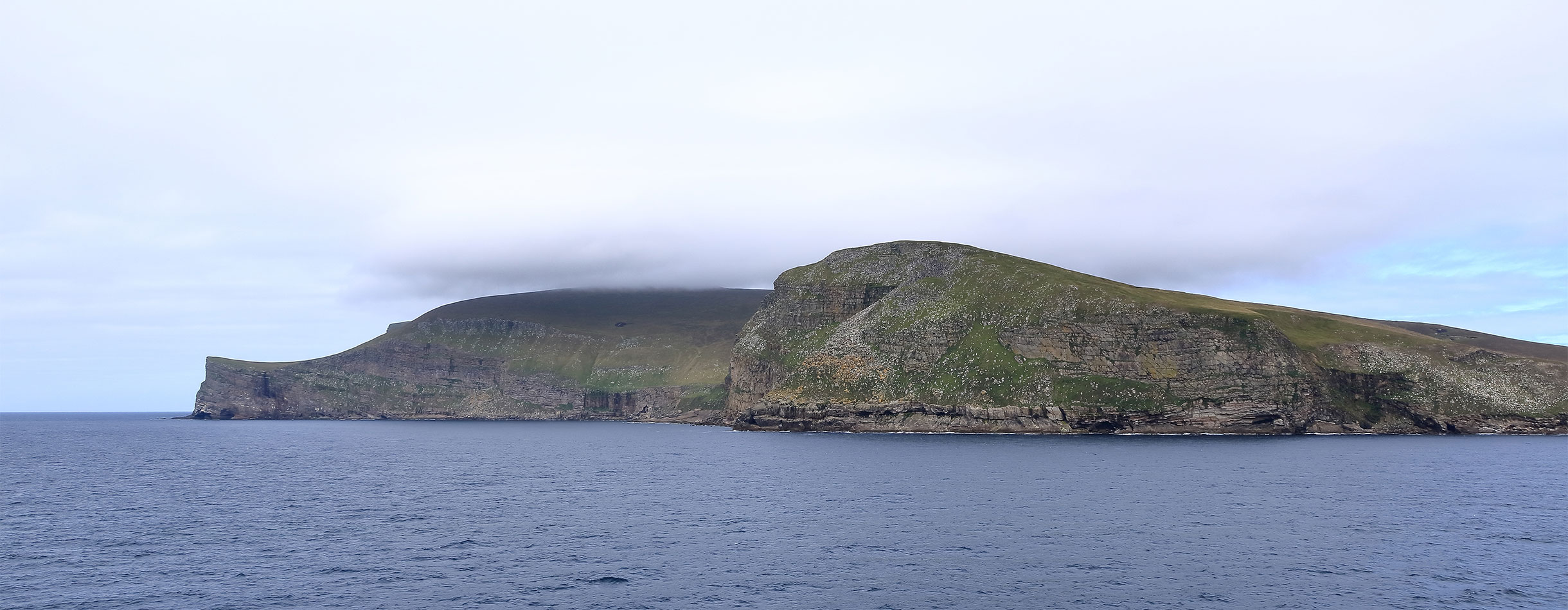 View to the Island Foula in Shetland, Scotland from the sea