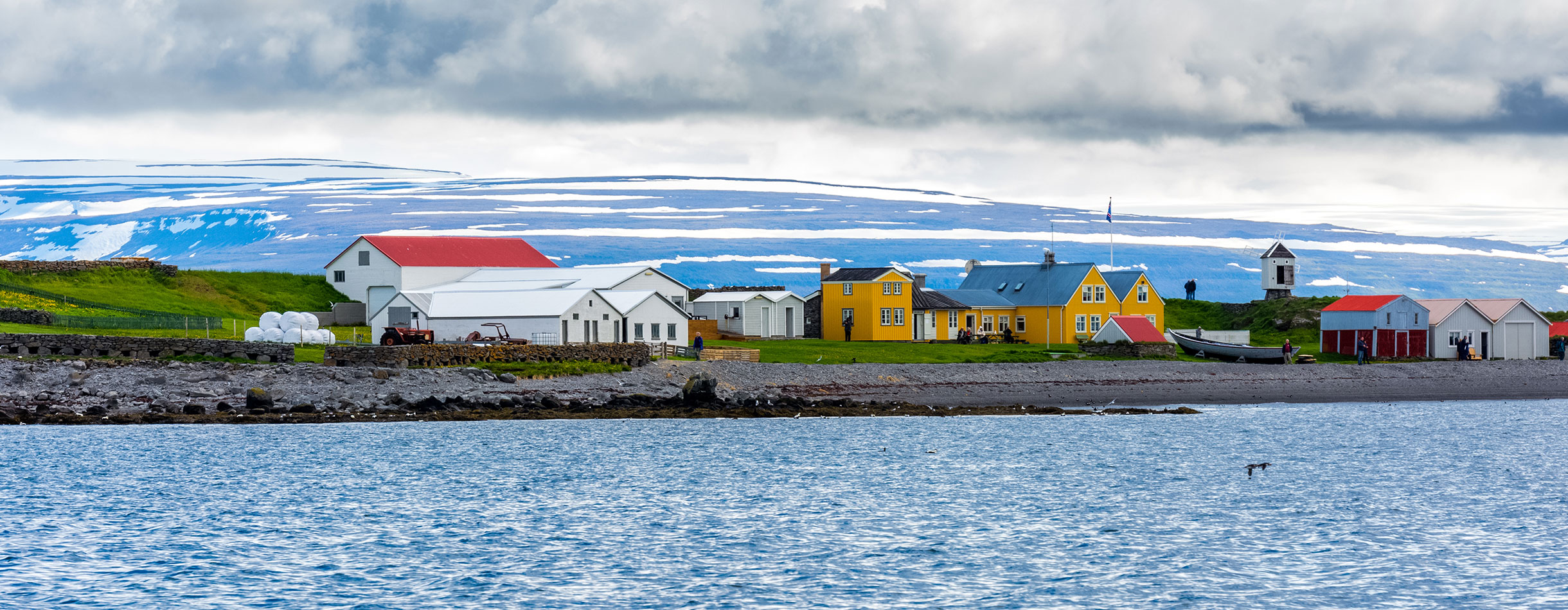 colorful wooden houses on the remote island of Vigur, on the Icelandic north western coast