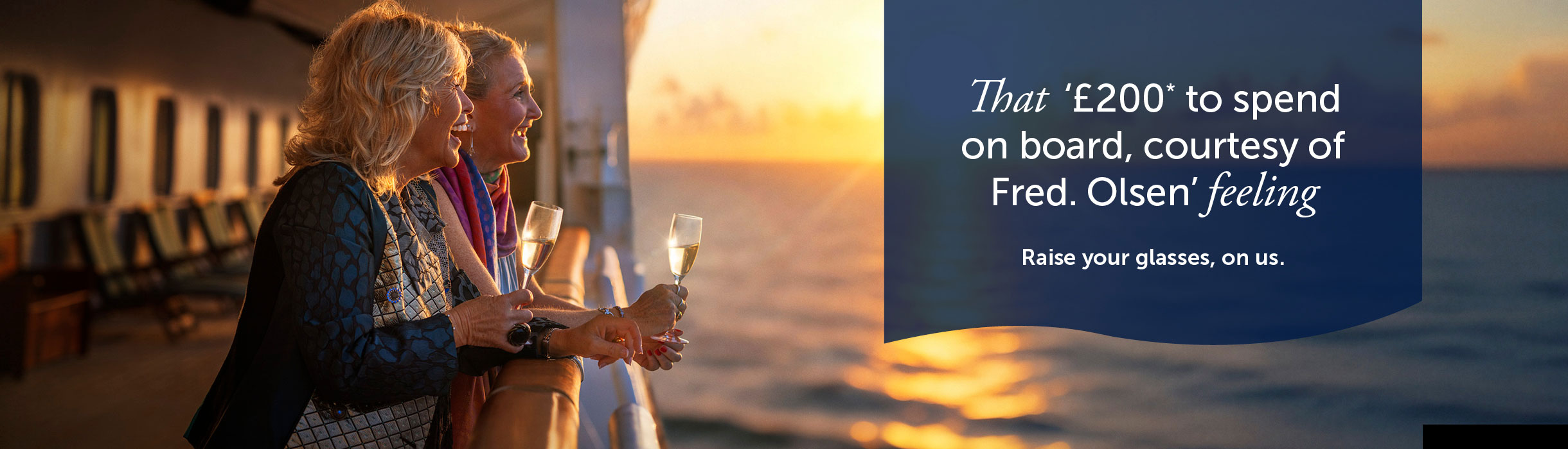 Guest looking out to sea from deck with drinks