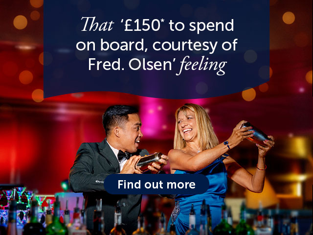 Bar waiter and guest making cocktails together in the martini experience on board