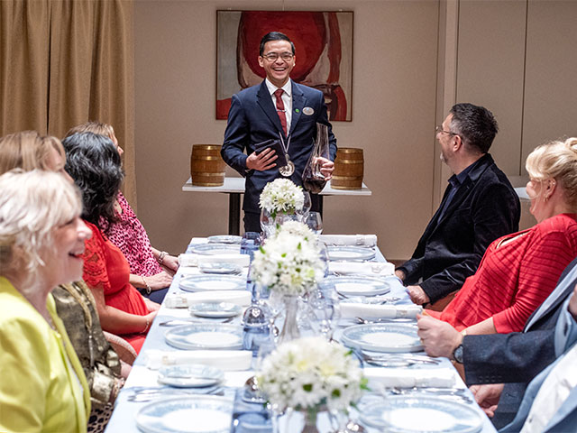 Guests dining at the Chefs table, Colours and Tastes restaurant, Borealis