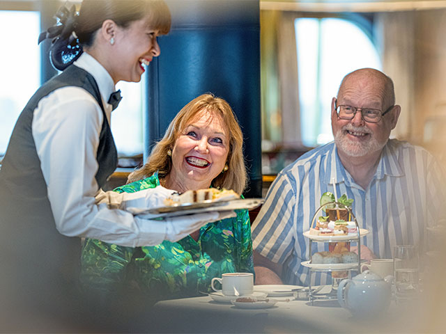 Guests being served Afternoon tea at the Jubilee event, Borealis