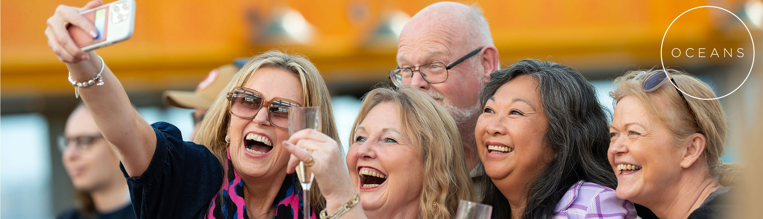 Oceans members taking a selfie, with oceans logo
