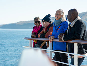 Guests looking out to sea from deck