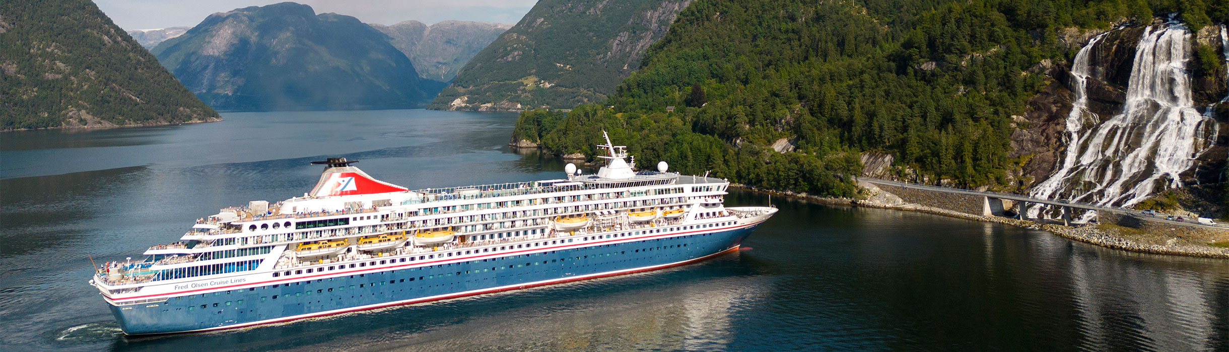 Balmoral cruising by Furebergsfoss waterfall, Norway