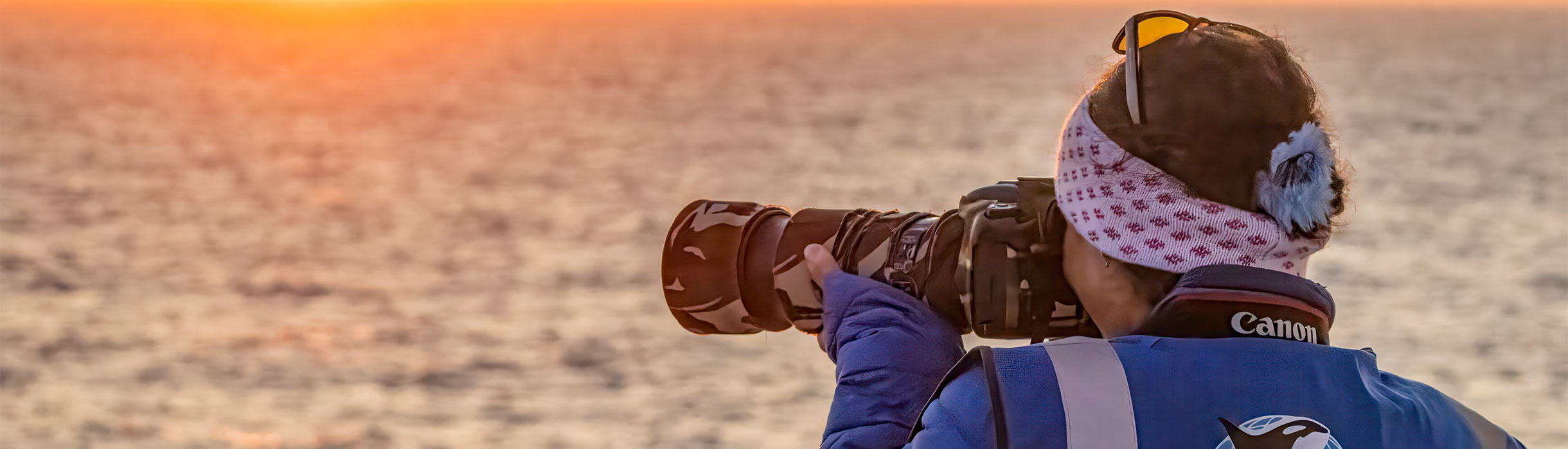 Orca representative taking photos on deck