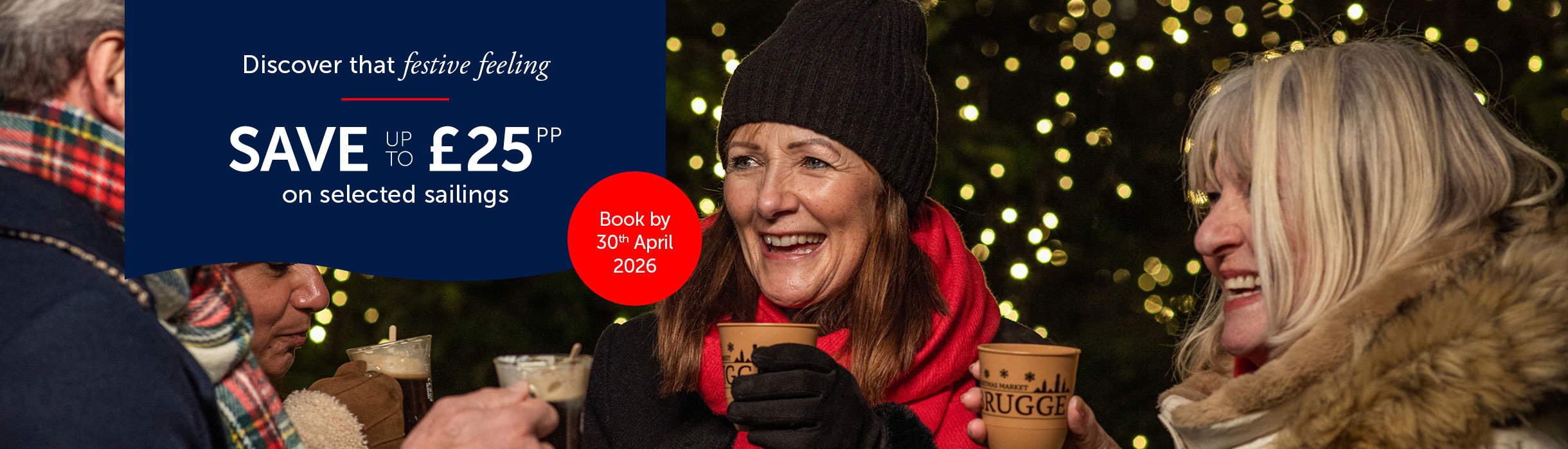 Guests enjoying hot drinks in warm clothes, festive lights