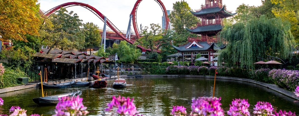 View of the lake in Tivoli Gardens with the rollercoaster behind