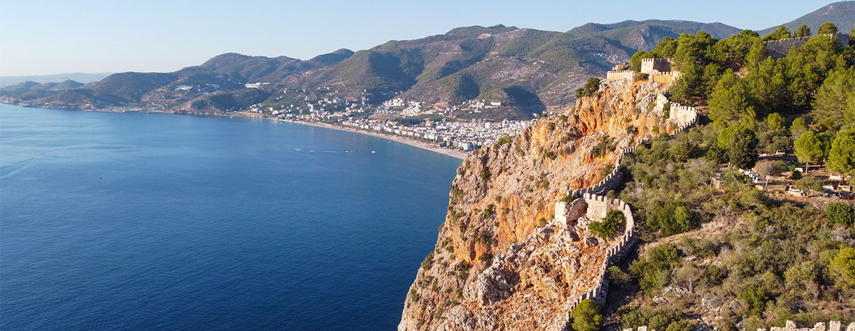 View of Historic Alanya Castle Walls with Kleopatra Beach in Alanya, Turkey