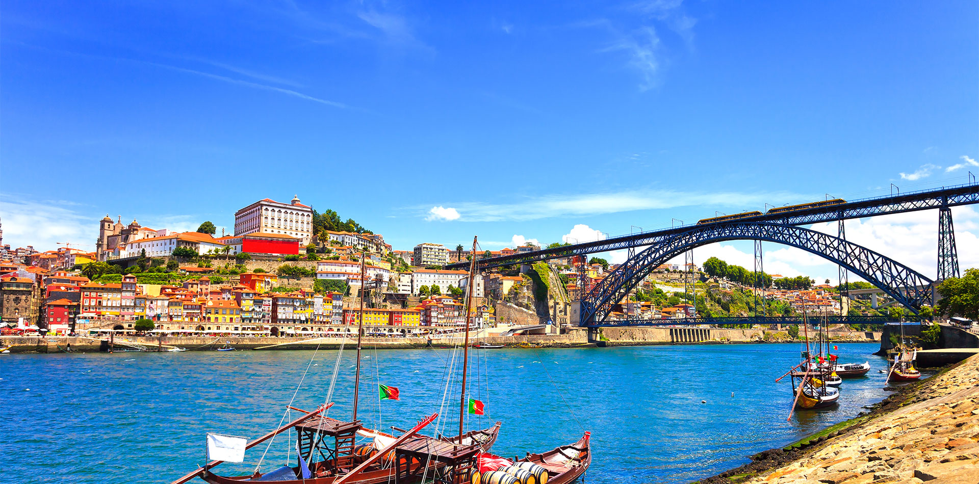 Oporto, Douro river, boats and iron bridge, Portugal